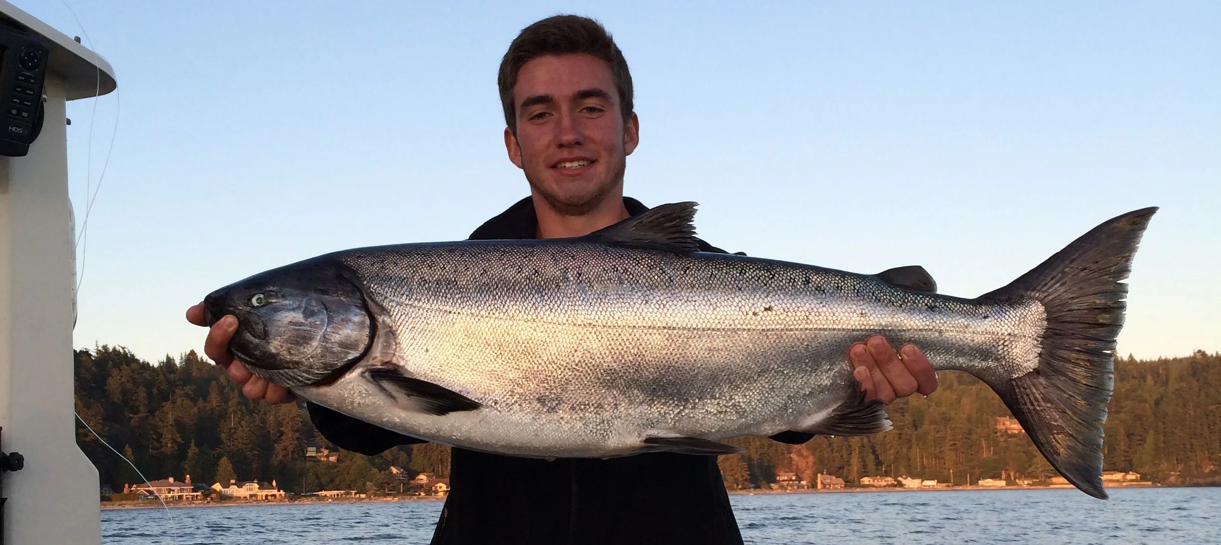 Guests sharing a catch from a R&R Charters fishing day